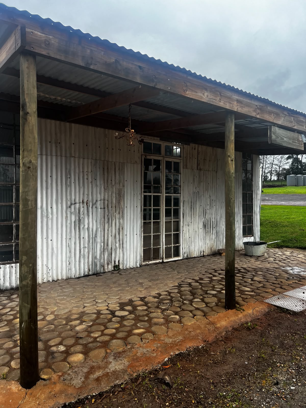 Covered veranda & cobbled floor